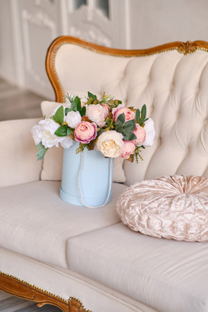 Large bouquet of decorative flowers in a pink hat boxの写真素材