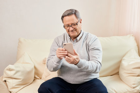 Portrait of smiling mature man using mobile phone