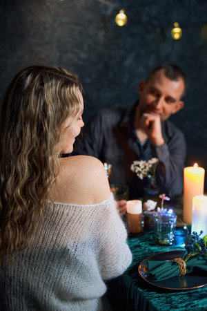 Romantic cute Couple at the Candlelit Restaurantの写真素材