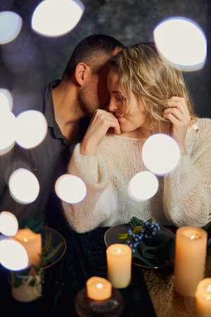 Romantic Candlelit Dinner Whisper in night restaurantの写真素材
