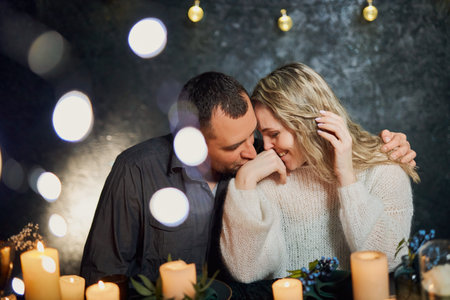 Romantic Candlelit Dinner Whisper in night restaurantの写真素材