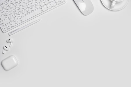 Total white workplace table on white background with copy space.の写真素材