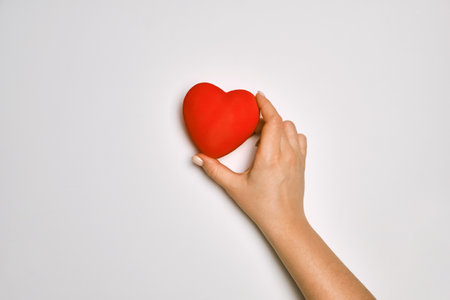 hands holding red heart, health care, love, organ donation, praying conceptの写真素材
