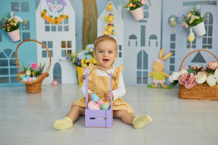 Funny cute girl in bunny ears celebrating Easterの写真素材