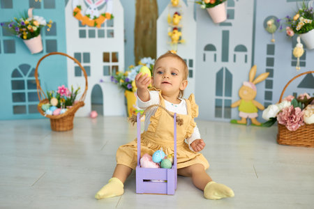 Funny cute girl in bunny ears celebrating Easterの写真素材