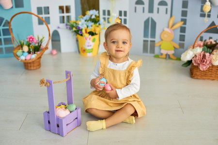 Funny cute girl in bunny ears celebrating Easterの写真素材