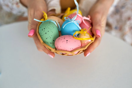 Selective focus on multicolor and design Easter Eggs on the hand.の写真素材