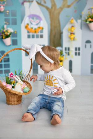 Funny cute girl in bunny ears celebrating Easterの写真素材