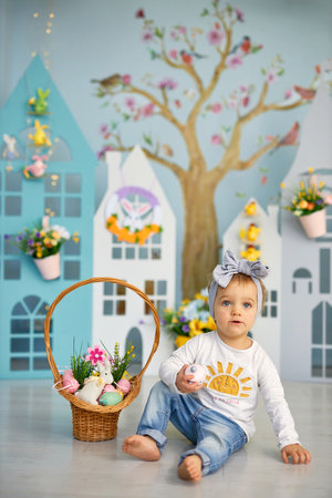 Funny cute girl in bunny ears celebrating Easterの写真素材