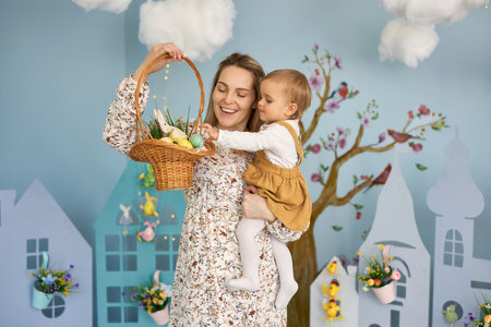 Mother and her daughter with painting eggs..の写真素材
