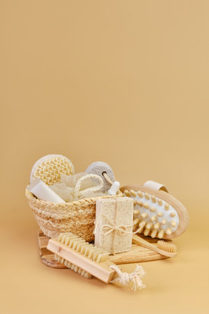 Bath accessories set in wicker basket on a beige background.の写真素材