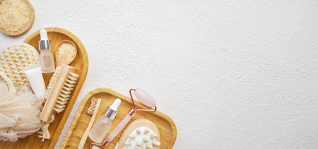 Spa and bathroom accessories on wooden tray, brush, oil, creamの写真素材
