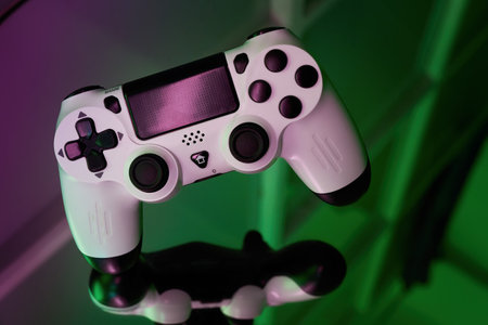 Gamepad on abstract background with light effects. Gamer and Game concept. Gaming background with copy spaceの写真素材