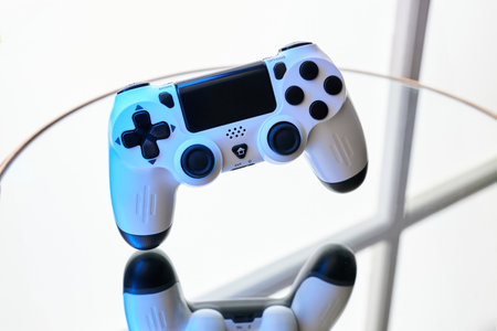 Gamepad on abstract background with light effects. Gamer and Game concept. Gaming background with copy spaceの写真素材