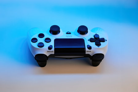 Gamepad on abstract background with light effects. Gamer and Game concept. Gaming background with...