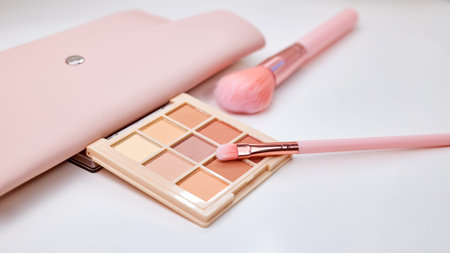 Widescreen background with Set of decorative cosmetics on a white table, brushes and eye shadow. Decorative cosmetics on dressing table in makeup roomの写真素材