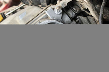 Car engine repair. Repair of a malfunction of the throttle valve of the car. The theme of cars, auto repair shops, repair.の写真素材