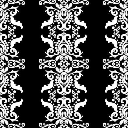 Ornate white pattern on a black background. Seamless pattern, vertical damask ornament. Lace pattern. Black and white color. Vector graphic vintage pattern. For fabric, tile, wallpaper or packaging.のイラスト素材