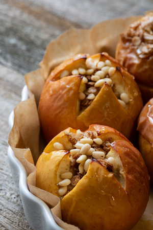 Baked delicious apples with granola. Watered with honeyの写真素材
