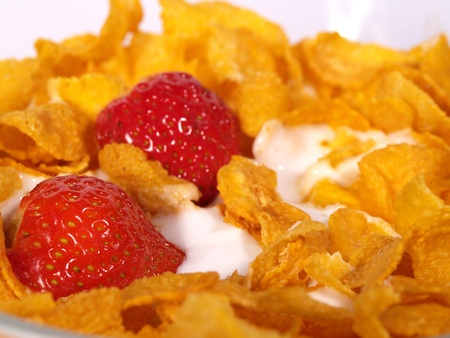 Cornflakes and Strawberries with milk for breakfast - morning meal