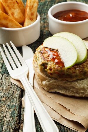 Spicy turkey burger on a wooden backgroundの写真素材