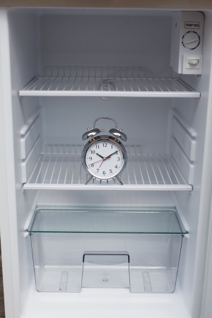 Noisy alarm clock hidden in a fridgeの写真素材