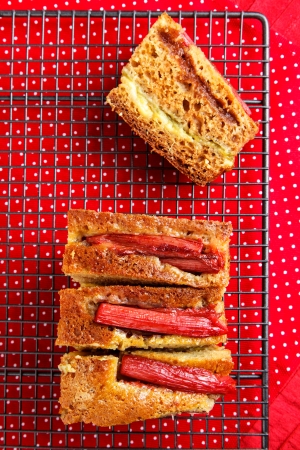 Rhubarb and custard cakes on a red backgroundの写真素材