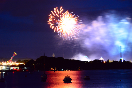 Fireworks reflecting from the river Medina at the Isle of Wight Festival.の写真素材
