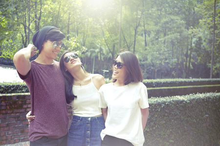 Friends hanging out together at a parkの写真素材