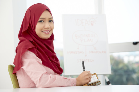 Portrait of smiling businesswoman in conference roomの写真素材