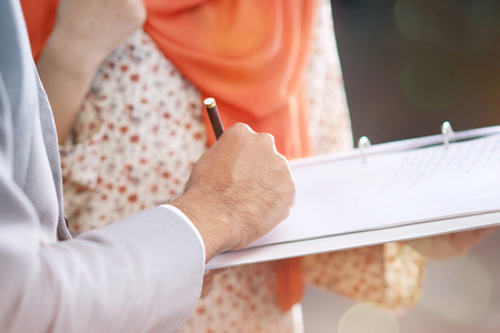 Young businessman and businesswoman having discussionの写真素材