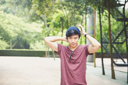 Young man posing at a parkの写真素材