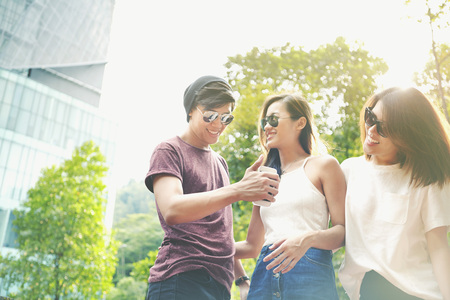 Friends hanging out together at a parkの写真素材