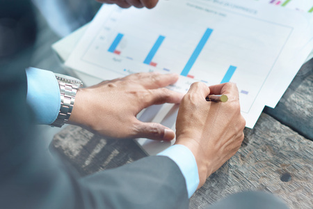 Businessman writing on paperの写真素材