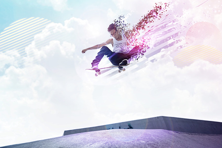 Young man doing skateboarding trick at a skate park