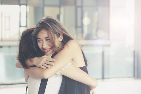 Friends hugging each otherの写真素材