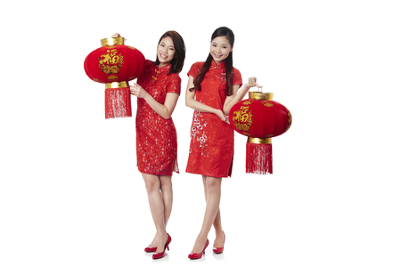 Young women holding Chinese lanternsの写真素材