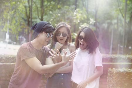 Friends hanging out together at a parkの写真素材