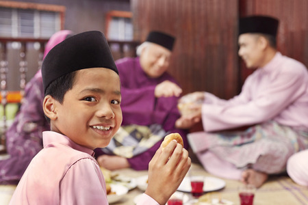 Family eating together during Hari rayaの写真素材