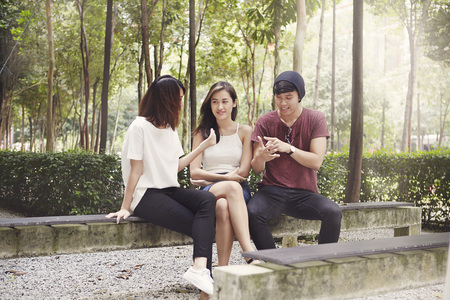 Friends hanging out together at a parkの写真素材
