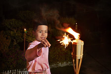 Young boy play with sparklersの写真素材