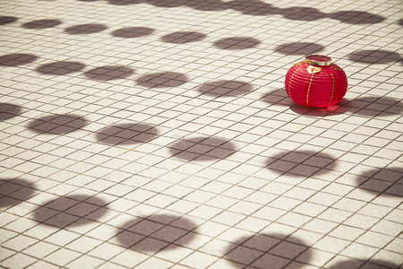 Fallen red lantern on the floorの写真素材