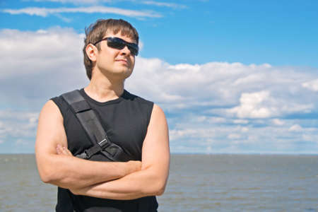 Handsome proud man at sea shore