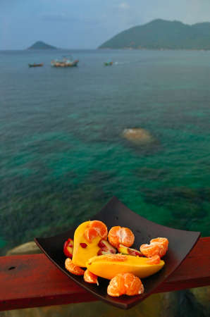 Exotic Fruitplate at seaside backgroundの写真素材