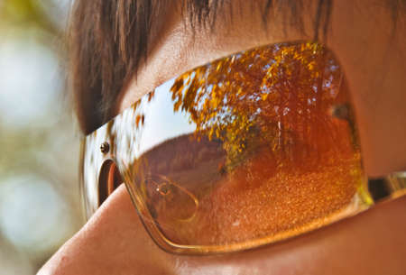 Autumn Park Reflections in Woman Sunglassesの写真素材