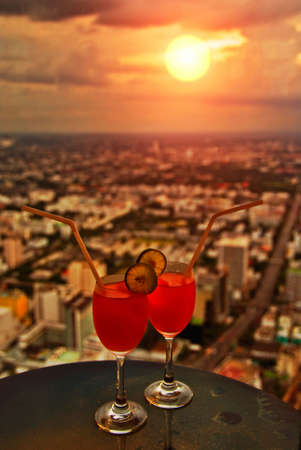 Sunset Cocktail at the End of a Busy Day in a Cityの写真素材