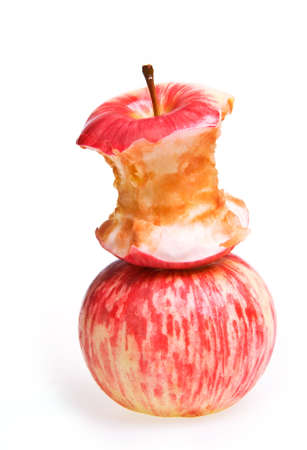 Two Apples - one full and one eatenの写真素材