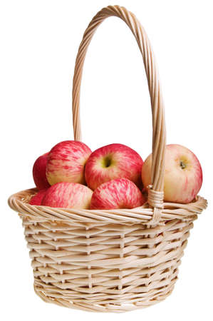 Red Astrachan apples in a straw basket isolated on whiteの写真素材