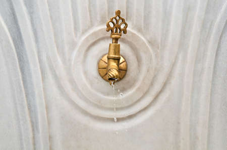 Ablutions tap on the marble fountain in the courtyard of The Blue Mosque , Istanbul.の写真素材