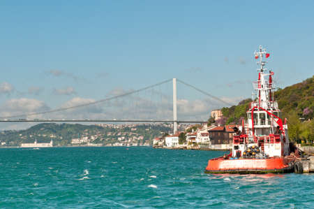 fatih sultan mehmet bridge and a ferry, Istanbul, Turkeyの写真素材